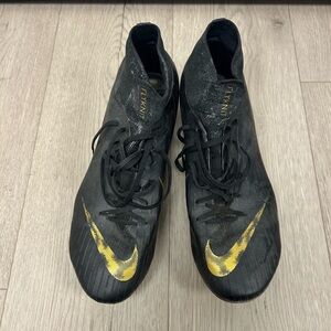 Nike Men’s Mercurial Superfly VI Elite Firm Ground Black and Gold Soccer Cleats